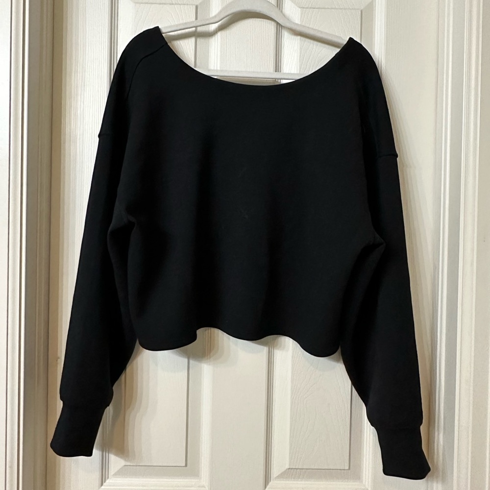 Lululemon twisted back pullover in black.